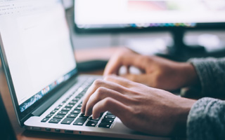 hands on laptop