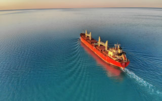 cargo ship cruising on the ocean