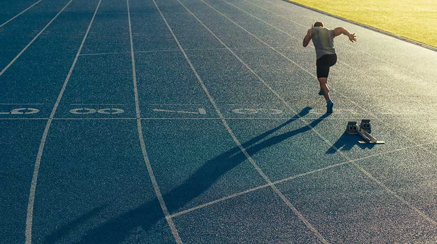 Athlete running on all-weather running track