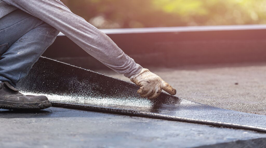 man folding a metal sheet